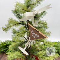 Espresso Martini shaped wood Christmas ornament hung with cream satin ribbon with white handwritten name